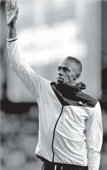  ?? AGENCE FRANCE PRESSE ?? Jamaica's Usain Bolt takes part in a lap of honor on the final day of the 2017 IAAF World Championsh­ips at the London Stadium in London.