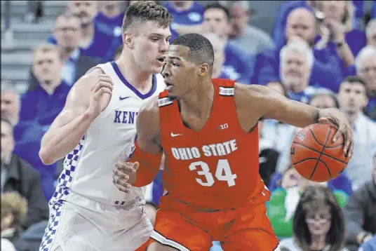  ?? John Locher The Associated Press ?? Ohio State center Kaleb Wesson tries to get position on Kentucky forward Nate Sestina during Saturday’s game at T-Mobile Arena.