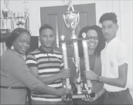  ??  ?? (L-R) REO Tiffany Favourite-Harvey, Diamond Secondary Skipper Philip Mc Turk, Annandale Captain Daniel Prashad and REO Pauline Lucas hold the REO/DEVCON Trophy that both teams are vying to win.