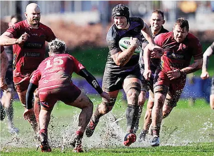  ?? ?? Action from Clifton’s game against Redruth which was played in wet conditions after heavy rain ahead of kick-off