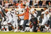  ?? Brian Bahr / Getty Images ?? UT needed just one overtime to beat Oklahoma State in 2020, a scenario the NCAA hopes becomes a trend.