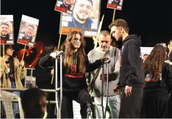  ?? (Violeta Santos Moura/Reuters) ?? MIA REGEV (C) and Itay Regev, who were hostages of Hamas in Gaza, attend a rally in December for the release of remaining hostages kidnapped October 7.