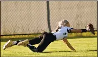  ?? PHOTOS BY ALEXIS MCDADE /Special to The Saline Courier ?? (TOP) The Lady Miners seniors pose for a picture Monday during the Senior Night game. (ABOVE) Jaycee Mcclellan makes a catch to close an inning Monday during the Lady Miners’ 1-0 win over White Hall.
(RIGHT) Kady Beth Jacks takes a swing.