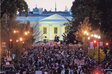  ?? GETTY IMAGES ?? People gather Saturday in Black Lives Matter Plaza near the White House to celebrate the Biden-Harris win.