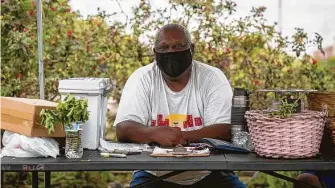  ??  ?? Kirk Jackson is an urban planner by trade but is also a board member of Blodgett Urban Gardens. Every Saturday he mans the garden’s food stand where residents can pick up produce.