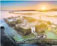  ?? ?? A misty sunrise over Carisbrook­e Castle on the Isle of Wight