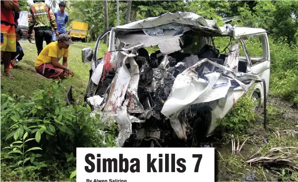  ?? (RICHEL V. UMEL) ?? The crumpled heap of a Toyota Hi-ace passenger van which figured in a head-on collision with a Simba Armored Personnel Carrier in Manticao town, Misamis Oriental Monday evening, July 17. The accident left 7 people dead and 8 others wounded, none of...