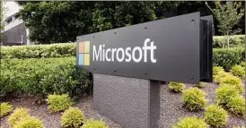  ?? Rick Rycroft / Associated Press ?? Microsoft shares rose Thursday following an early slide after the company cut its financial forecast for the current quarter.