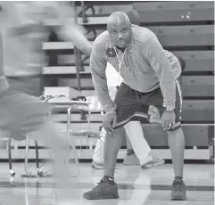  ?? STAFF FILE PHOTO BY TIM BARBER ?? Coach Rodney English will lead his East Hamilton boys’ basketball team into the Waffle House MLK King of the Court games at UTC’s Maclellan Gymnasium for the second consecutiv­e year Saturday. This year the Hurricanes are facing Believe Prep.