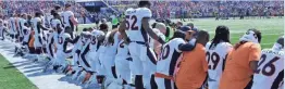  ?? MARK KONEZNY/USA TODAY SPORTS ?? Denver Broncos players kneel during the national anthem.