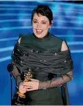  ??  ?? Olivia Colman accepts the award for best performanc­e by an actress in a leading role for The Favourite at the Oscars.