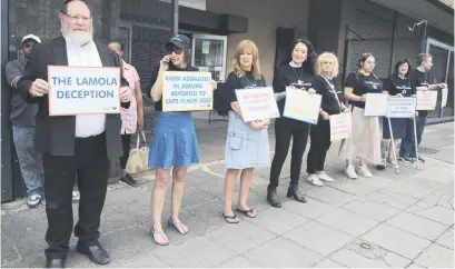  ?? Picture: Neil McCartney ?? LISTEN UP. The South African Jewish Board of Deputies picket outside the offices of Minister of Justice and Correction­al Services Ronald Lamola in Pretoria yesterday.