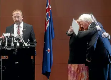  ?? KEVIN STENT/STUFF ?? Pike River Minister Andrew Little, left, announces the re-entry of the mine in February 2019, as family members, from left, Anna Osborne, Sonya Rockhouse (obscured) and Bernie Monk embrace.