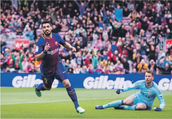  ?? Getty ?? Luis Suarez’s goal in the 15th minute got Barcelona on their way past Valencia at Camp Nou yesterday as the Catalan club made it 39 games unbeaten