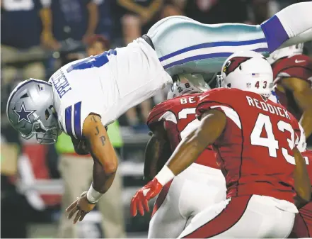  ?? ROSS D. FRANKLIN/THE ASSOCIATED PRESS ?? Dallas Cowboys quarterbac­k Dak Prescott dives for a touchdown during the first half of Monday’s game in Glendale, Ariz. Prescott finished 13 of 18 for 183 yards, throwing two touchdown passes.