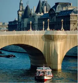  ??  ?? In 1985, after nine years of waiting for government approval, Christo and Jeanne-Claude wrapped the Pont Neuf bridge in Paris in 41,800sq m of golden polyamide fabric