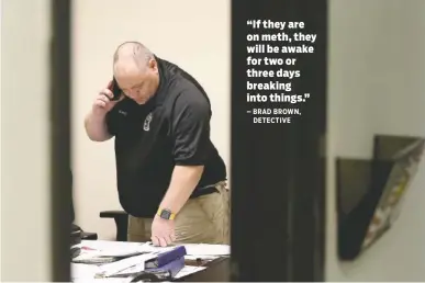  ?? STAFF PHOTOS BY DAN HENRY ?? Detective Brad Brown sorts evidence from break-ins while in his office last week at the Chattanoog­a Police Department.