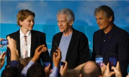  ?? ?? Director David Cronenberg (centre) with Crimes of the Future co-stars Léa Seydoux and Viggo Mortensen at Cannes film festival. Photograph: Stéphane Mahé/Reuters