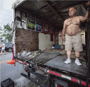  ?? AL DIAZ adiaz@miamiheral­d.com ?? Francisco Rondon, 80, a sex offender, says he pays rent to sleep in this truck so he does not have to sleep outdoors.