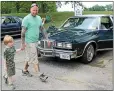  ?? NEWS-HERALD FILE ?? Chald Miller of Chardon walks the Mentor Cruise-In with his son Chase in 2016. The car show returns Aug. 14.