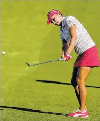  ?? ASSOCIATED PRESS ?? Lexi Thompson chips from the fairway on the second hole during her round of 68 in the LPGA Tour ANA Inspiratio­n on Friday.