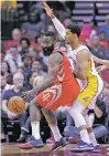  ?? MICHAEL WYKE/THE ASSOCIATED PRESS ?? Rockets guard James Harden, left, scored 51 points in Wednesday’s game against the Lakers, but Los Angeles won 122-116 to snap Houston’s 14-game winning streak.