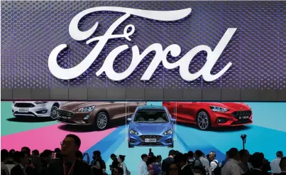  ?? (Jason Lee/Reuters) ?? THE NEW Ford Focus is displayed during a media preview at the Auto China 2018 auto show in Beijing last week. Responding to a shift in consumer demand to SUVs and pickup trucks, Ford said it planned to trim its North American car portfolio to just two...