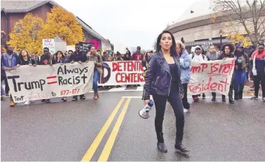  ?? THE ASSOCIATED PRESS ?? Joseline Tlacomulco leads several hundred people in a march on the University of Connecticu­t campus Wednesday in Storrs, Conn., protesting the election of Donald Trump as president. Tlacomula, a sophomore who lives in New Haven, said she was born in...