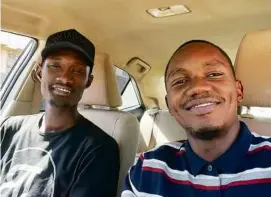  ?? HASSAN TIBWA VIA NEW YORK TIMES ?? Sami al-Gada (left) and Hassan Tibwa were classmates at a university in Khartoum, who had a side gig driving a taxi.