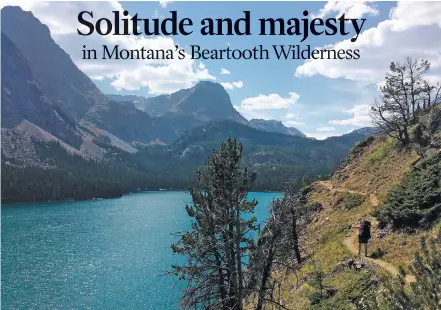  ?? BEN YEOMANS VIA THE ASSOCIATED PRESS ?? Mike Eckel hikes above a lake along the Beaten Path, a 26-mile hiking trail that crosses through Montana’s Absaroka-Beartooth Wilderness.