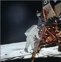  ?? NEIL ARMSTRONG — NASA VIA AP ?? In this photo made available by NASA, astronaut Buzz Aldrin Jr. descends a ladder from the Lunar Module during the Apollo 11 mission.