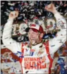  ?? TERRY RENNA — THE ASSOCIATED PRESS ?? Dale Earnhardt Jr. celebrates in Victory Lane in 2014 after winning the Daytona 500 at Daytona Internatio­nal Speedway in Daytona Beach, Fla.