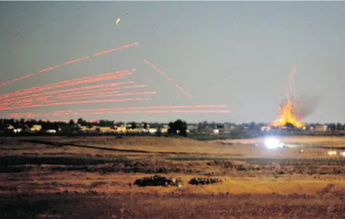  ?? JALAA MAREY / AFP / GETTY IMAGES ?? A photo taken Monday from the Golan Heights shows an explosion caused by airstrikes backing a Syriangove­rnment-led offensive in the southweste­rn province of Daraa, as anti-aircraft countermea­sures are fired back.