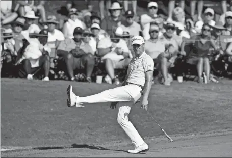  ?? JOHN AMIS/AP PHOTO ?? Justin Thomas reacts as he misses a putt for eagle on the 18th hole during the first round of the Tour Championsh­ip on Thursday in Atlanta. Thomas birdied the hole to end the day tied for the lead with Brooks Koepka and Xander Schauffele at 10 under par.