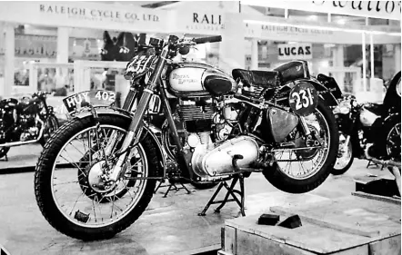  ??  ?? Stand preparatio­ns for the 1949 Earls Court Show were clearly incomplete when this glass plate image of Charlie Rogers’ Internatio­nal Six Days’ Trial gold medal-winning 350cc ohv Royal Enfield Bullet was taken. The Redditch firm pioneered swinging-arm rear suspension with this model, and many other manufactur­ers would follow suit during the following decade.
