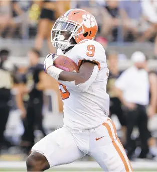  ?? CHUCK BURTON/AP ?? Clemson’s Travis Etienne is the one tailback who could break into the field of Heisman Trophy candidates. Averaging less than 13 carries per game, he’s amassed 8.6 yards per carry and has 15 touchdowns.