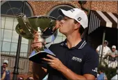  ?? BRYNN ANDERSON — THE ASSOCIATED PRESS ?? Patrick Cantlay kisses the trophy after winning the Tour Championsh­ip and the FedEx Cup at East Lake Golf Club on Sunday in Atlanta.