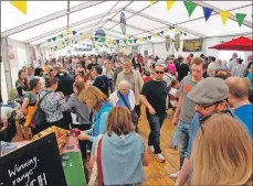  ??  ?? Above: The atmosphere is always fantastic at the bustling Loch Fyne Food Fair. 06_a21foodfai­r01