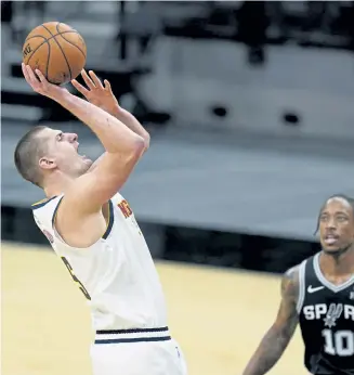  ?? Eric Gay, The Associated Press ?? Nuggets center Nikola Jokic scored 35 points in Friday night’s 119-109 loss to the San Antonio Spurs. He scored 23 of his 35 points in the second half.