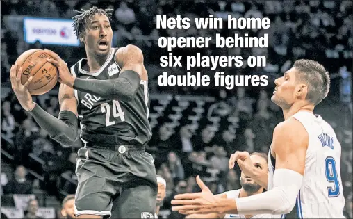  ?? Corey Sipkin ?? MAKING A POINT: Rondae Hollis-Jefferson, who scored 15 points, looks to make a pass in the Nets’ 126-121 win over the Magic at Barclays Center on Friday night, the same day point guard Jeremy Lin had season-ending knee surgery.