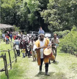  ??  ?? Leon Gregory of the Taino Heritage Park at Eden Hill, St Mary, leading a procession on the property during an Areyto celebratio­n, recently.