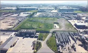  ??  ?? An aerial view of the “table-top” Blackheath vacant industrial stand (the grassed square in the centre of the picture), measuring 2.2273ha, which In2Assets will auction in Cape Town on August 28.