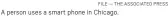  ?? FILE — THE ASSOCIATED PRESS ?? A person uses a smart phone in Chicago.