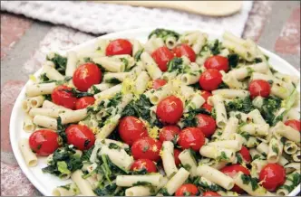  ?? The Associated Press ?? This April 2017 photo shows penne with tomatoes, garlic, lemon and spinach in Coronado, Calif.