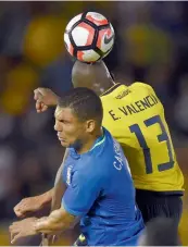 ?? — AP ?? Brazil midfielder Casemiro ( left) and Ecuador forward Enner Valencia go up for a header.