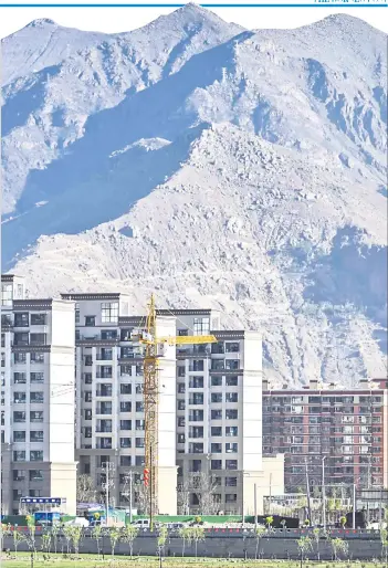  ??  ?? A general view of new buildings under constructi­on in the regional capital Lhasa in China’s Tibet Autonomous Region.