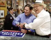  ?? FILE PHOTO ?? IN THIS 2018 PHOTO, BOB LUTES SHAKES HANDS with Gov. Doug Ducey during a campaign stop at Lutes Casino.