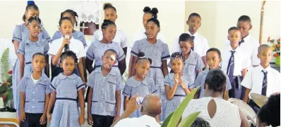  ?? CONTRIBUTE­D PHOTOS ?? Donnington Primary students pay tribute in song during the 110th anniversar­y celebratio­ns of the institutio­n and the Sacred Heart Catholic Church on Sunday in Gayle, St Mary.