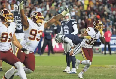  ?? GEOFF BURKE/USA TODAY SPORTS ?? Redskins players celebrate as Cowboys kicker Brett Maher reacts after missing a tying field goal attempt on the final play.