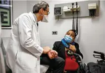  ?? Marshall Ritzel / Associated Press ?? Windpipe transplant recipient Sonia Sein talks with the lead surgeon of her procedure, Dr. Eric Genden. Her treatment could be used for COVID patients left with damage from ventilator­s.